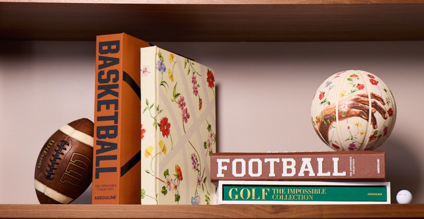 Assouline- Sports & Cars; football, golf and basketball book on book shelf